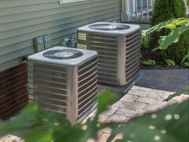 Dual HVAC units outside a Central Massachusetts home