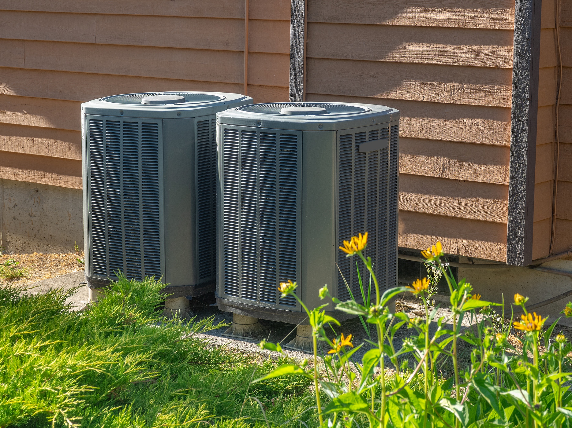 Dual HVAC units outside a Central Massachusetts home