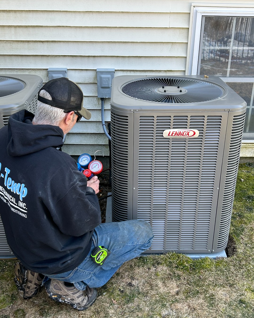 All-Temp tech working on a Lennox HVAC system